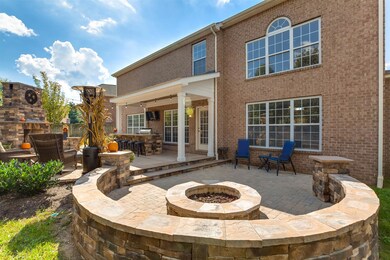 $60K invested into this back yard recently. Fire pit, pavers, & more!