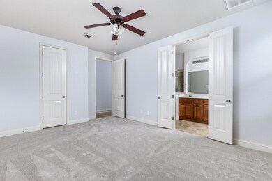 Unfurnished bedroom with connected bathroom, ligh