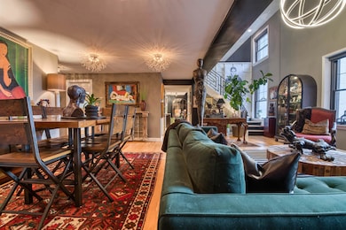 Living room featuring baseboards, a notable chande