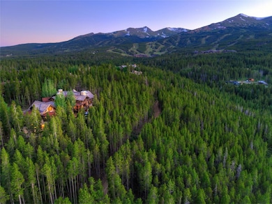 3.5 Acres! Bird's eye view of a heavily wooded area and mountains