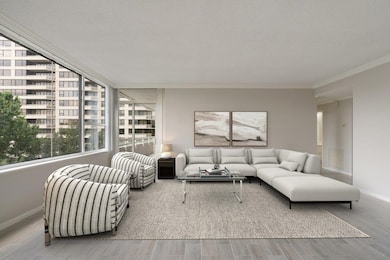 Living room with balcony access. Virtually staged.
