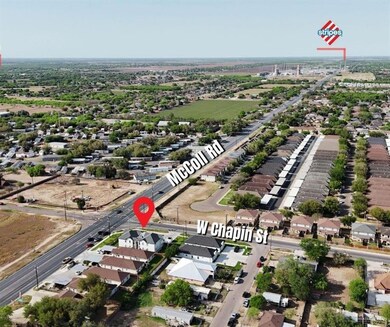 Aerial overview of property's location with nearby suburban area