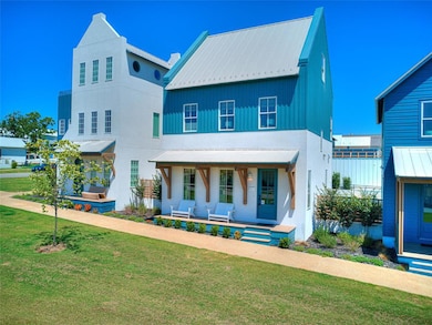 View of front of house with a porch and a front ya