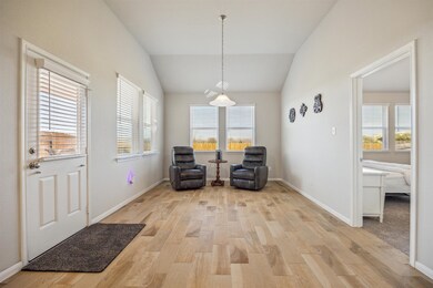 This bright, inviting room features tile floors, a