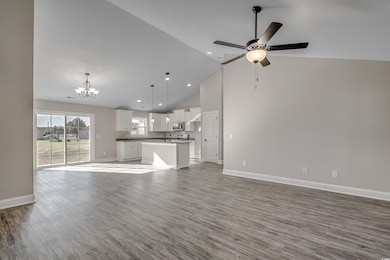 Unfurnished living room with hardwood / wood-style