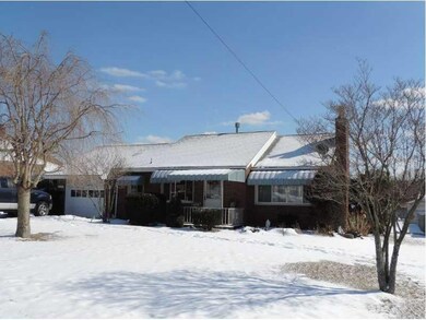 Exterior Front. The mature flowering trees in this