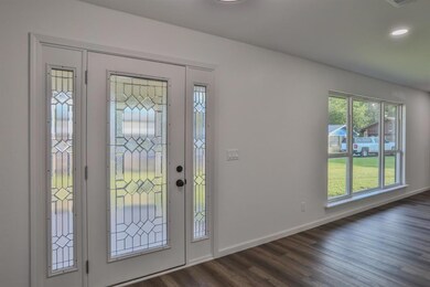 Foyer with dark wood-type flooring