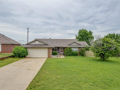 Single story home featuring a front yard, roof wit