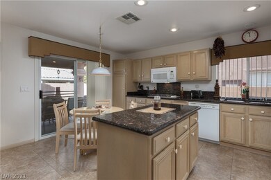 Beautiful kitchen with granite counter-tops, doubl