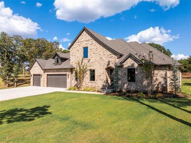 French provincial home featuring a front yard