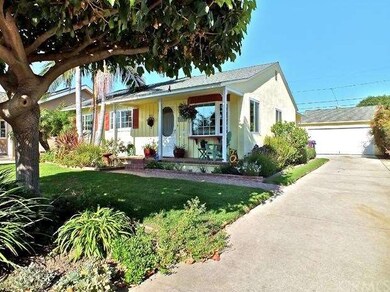 Front of Home and long Driveway to Garage
