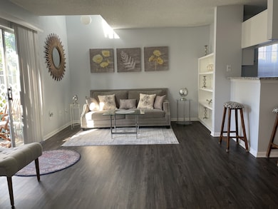 Spacious living room with high end vinyl plank flo