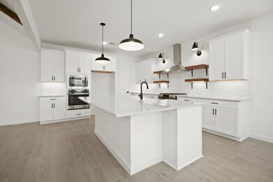 Kitchen with stylish floating shelves