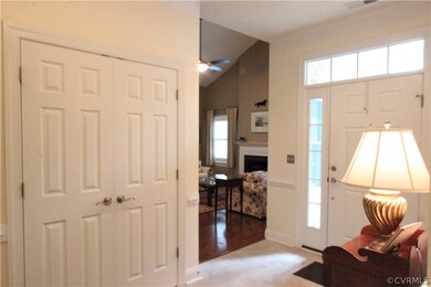 Front Door Accented with Transom and Sidelights ~