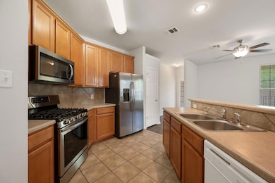 Kitchen with stainless steel appliances, tasteful