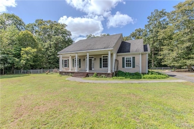 View of front of property with a front lawn and a