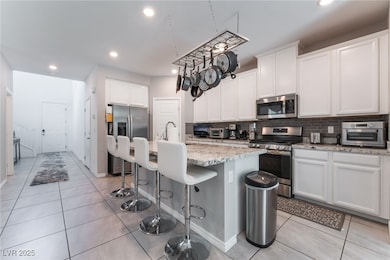 Kitchen featuring appliances with stainless steel
