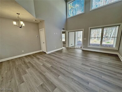 2-Story Great Rm w/lots of light from window wall, attached dinette & LVP flooring