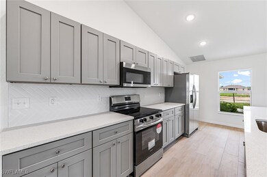 Kitchen featuring appliances with stainless steel