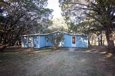 Three bedroom One Bath. New paint interior and exterior, new windows installed in front bedroom of cabin, replaced sliding glass door with French Door.
