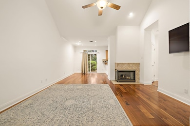 Unfurnished living room featuring a ceiling fan, 