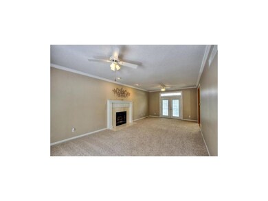 FORMAL LIVING ROOM WITH FIREPLACE & FRENCH DOORS L