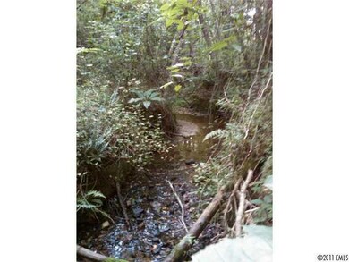 Exterior Front - picture of stream running through property