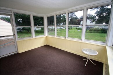 Enclosed porch off the living room.