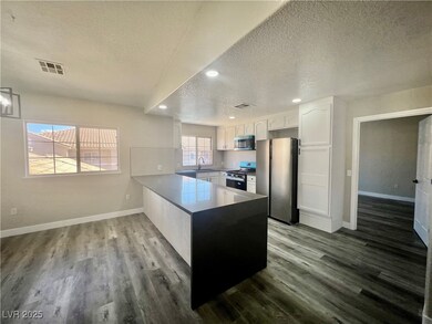 Kitchen with stainless steel appliances, a texture