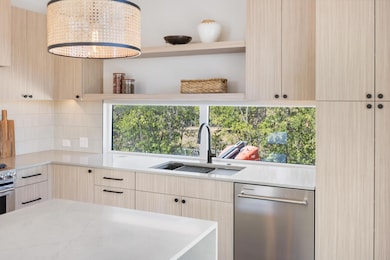 Kitchen featuring open shelves, light brown cabin