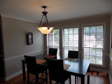 ANOTHER VIEW OF THE SPACIOUS DINING ROOM WITH HARD