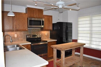 What a great kitchen! The butcher block island wil