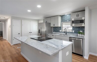 Kitchen with light hardwood / wood-style flooring,