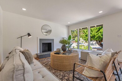 Bright and airy living room with windows overlooking the front yard