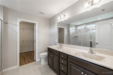 Bathroom featuring tile patterned flooring, a show