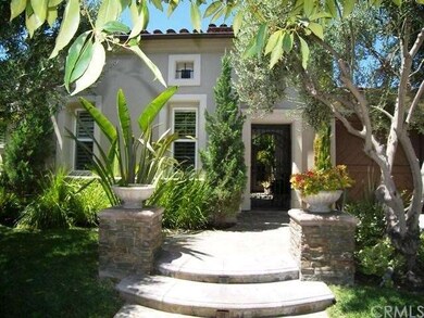 Stone enhanced entrance with gated courtyard