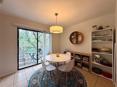 Dining room with light tile patterned floors