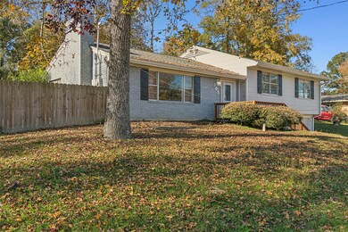 Charming split-level home with a white brick exter