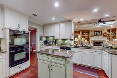 Island Kitchen with double oven, tasteful backsplash, Shaker cabinets, overlooking Family room!