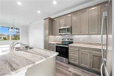 Kitchen with appliances with stainless steel finis