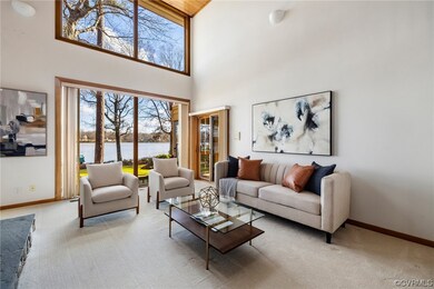 Living room w/ gas FP, water views and 2-story cei