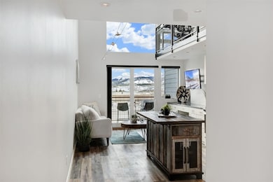 The entry hall opens up to the spacious living are