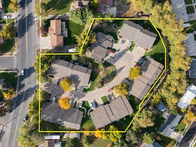 Aerial view of residential area featuring property parcel outlined