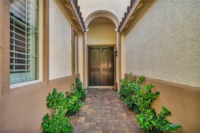 View of exterior entry with stucco siding