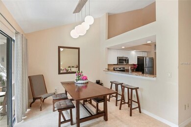 Dining room has easy access to kitchen bar and por