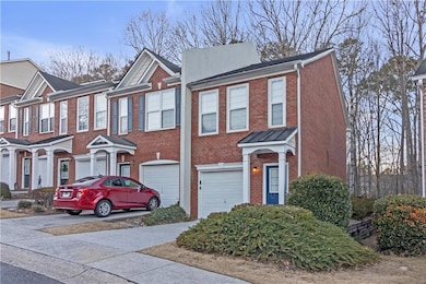 Townhome / multi-family property with a garage