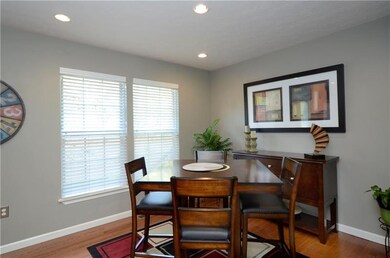 Dining area comes with hardwood flooring
