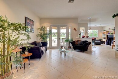 BRIGHT FORMAL LIVING ROOM WITH OVERSIZED FRENCH DO