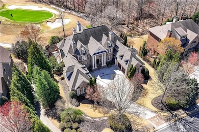 Birds eye view of property with golf course view