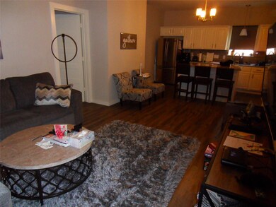Living area featuring dark wood finished floors a